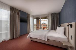 Postelja oz. postelje v sobi nastanitve b-smart hotel Arbon