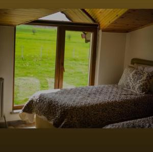 a bedroom with a bed in front of a window at Meriç butik otel 