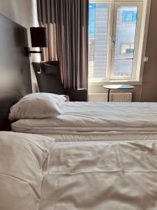 Postel nebo postele na pokoji v ubytování Zefyr Hotel