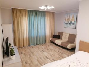 a small living room with a couch at Jurmala Kauguri in Jūrmala