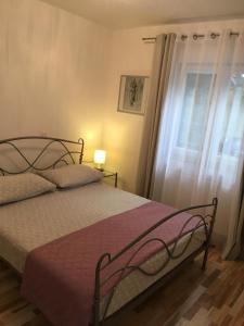 Posteľ alebo postele v izbe v ubytovaní Apartments Salona