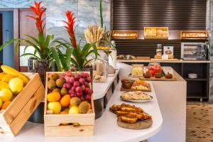 a buffet with many different types of fruits and pastries at HF Fenix Garden in Lisbon
