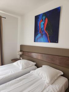 Cama ou camas em um quarto em Hôtel & Restaurant Les Mouettes