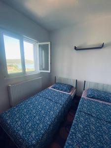 Postel nebo postele na pokoji v ubytování Island Šolta Comfort apartment Modesty