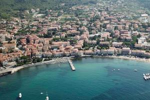an aerial view of a beach with boats in the water at Casa Lucietta, 30 mt dal mare e posto auto privato in Marciana Marina