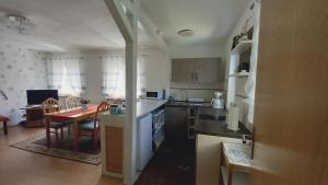 a kitchen with a table and a dining room at Ferienwohnung Beck in Trassenheide