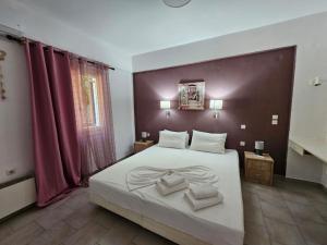 Posteľ alebo postele v izbe v ubytovaní Corfu Glyfada Menigos Resort 149