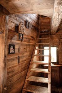 a wooden room with a staircase in a cabin at Troadkasten - Nationalpark Kalkalpen in Ramsau