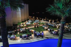 an overhead view of a party at the resort at night at Mimoza Beach Hotel in Yenibosazici