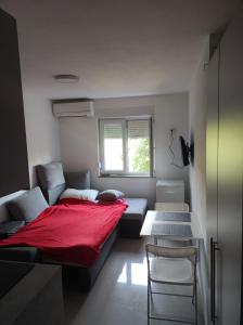 Postel nebo postele na pokoji v ubytování Studio apartman Tombo