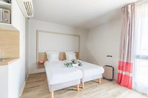 Cama o camas de una habitación en Appart'City Confort Bordeaux Chartrons