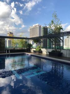 a large swimming pool on top of a building at PTH Residence in Phnom Penh