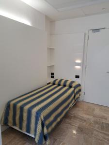 Postel nebo postele na pokoji v ubytování Hotel Consuelo