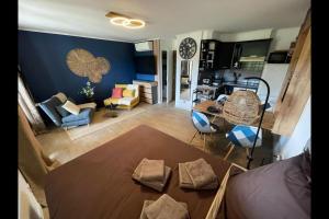 an aerial view of a living room and dining room at Studio Cocoon Hut in Villeneuve-Loubet
