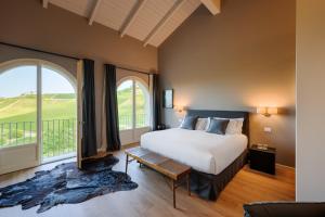 Postel nebo postele na pokoji v ubytování iCOLLIROSSI Agriturismo