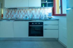 A kitchen or kitchenette at Appartamenti Craulo