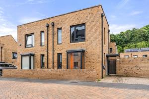 a brick building with windows on a street at Stunning 2 Bed in Sheffield - Parking - Garden in Sheffield