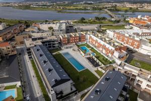 an aerial view of a city with buildings at LOCA OFIR Duplex - Entre Rio e Mar in Fão