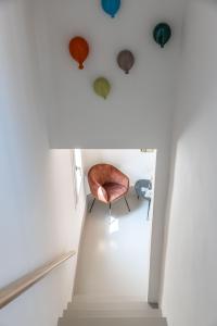 a room with a chair sitting on top of a staircase at Apartment Natale 2 in Monopoli