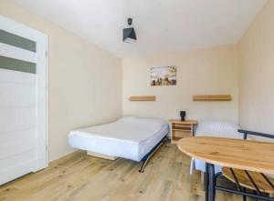 Postel nebo postele na pokoji v ubytování Pokoje Gościnne Irys