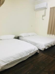 Una cama o camas en una habitación de Starry Sky Hostel