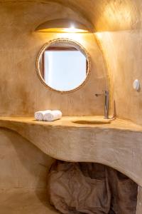a bathroom with a sink and a mirror at Caval I in Fira