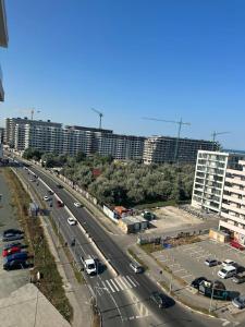 a highway with cars parked in a parking lot at Koya Tower by Lake Mamaia in Mamaia