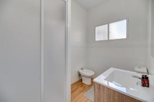 a white bathroom with a sink and a toilet at LXR Vistahermossa 3BDR. Apt Next to sea in Fuengirola