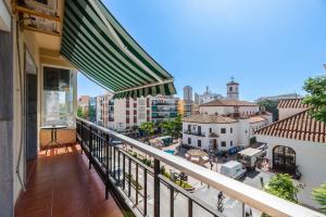 a balcony with a view of a city at LXR Vistahermossa 3BDR. Apt Next to sea in Fuengirola