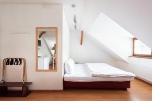 Postel nebo postele na pokoji v ubytování Apartmán Muzeum obchodu