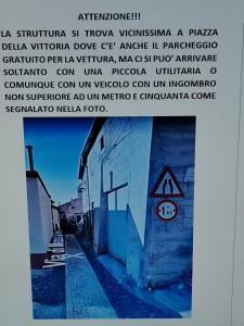 a picture of a sign on the side of a building at Casa MANETTA in Calascio
