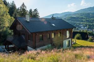a house sitting on top of a hill at Le Chalet Skalite in Szczyrk