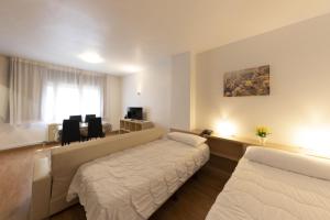 Letto o letti in una camera di La Solana Apartaments & Spa