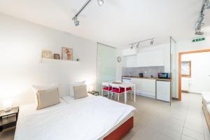 Postel nebo postele na pokoji v ubytování Apartmán Muzeum obchodu