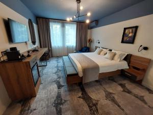 Postel nebo postele na pokoji v ubytování Bucharest Comfort Suites Hotel
