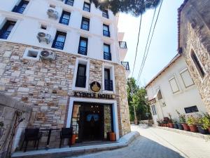 a building with the entrance to a coffee house at Foça Kybele Hotel in Izmir