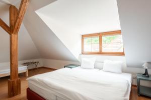 Postel nebo postele na pokoji v ubytování Apartmán Muzeum obchodu