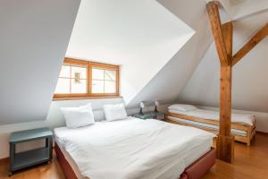 Postel nebo postele na pokoji v ubytování Apartmán Muzeum obchodu