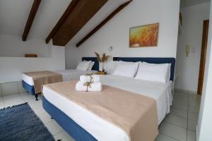 Ein Bett oder Betten in einem Zimmer der Unterkunft Xastero