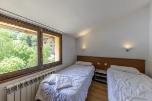 Letto o letti in una camera di La Solana Apartaments & Spa