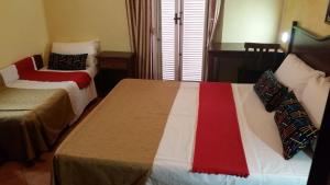 Postel nebo postele na pokoji v ubytování Hotel Chopin