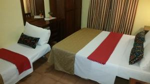 Postel nebo postele na pokoji v ubytování Hotel Chopin