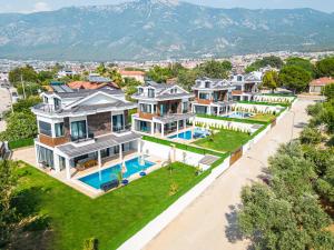 an aerial view of a mansion with a swimming pool at CAPELLA VİLLAS in Fethiye
