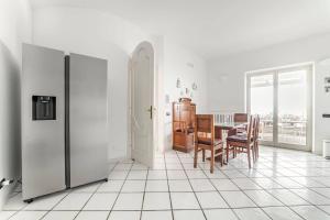 a kitchen with a table and a dining room at Amalfi coast-Praiano Villa Cristina no steps in Praiano