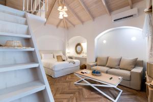 a living room with a couch and a table at The Well Parga in Parga