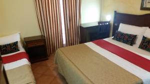 Postel nebo postele na pokoji v ubytování Hotel Chopin