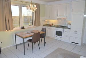 Η κουζίνα ή μικρή κουζίνα στο Haus am Golfplatz Nr 06 Ferienwohnung Strandblick +9 φωτογραφίες