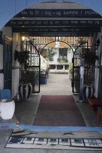 an entrance to a building with an open gate at Reersø Kro in Reersø