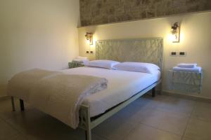 Postel nebo postele na pokoji v ubytování Villa Arianna - Suite Arianna