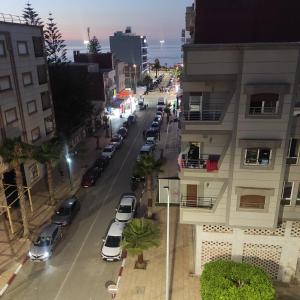 an aerial view of a street with parked cars at Kamal in Saidia 